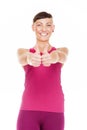 Portriat of fitness woman with thumbs up. Isolated over white ba