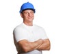 Portriat of man with helmet, worker white shirt. Crossed arms.