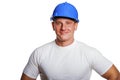 Portriat of man with helmet, worker white shirt.