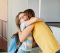 child mother daughter backpack house education school family student welcome hug together love woman elementary home Royalty Free Stock Photo