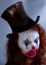 Portriat of a Young woman ins scary clown make up. Royalty Free Stock Photo