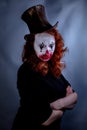 Portriat of a Young woman ins scary clown make up. Royalty Free Stock Photo
