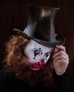 Portriat of a Young woman ins scary clown make up. Royalty Free Stock Photo