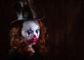 Portriat of a Young woman ins scary clown make up. Royalty Free Stock Photo