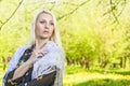 Portrit of Dreaming Caucasian Blond Woman Posing Outside