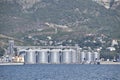 Portside Plant for storage, drying and handling of grain. Port freight infrastructure. Cargo port with port cranes. Sea bay and mo Royalty Free Stock Photo