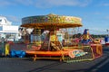 A traditional English merry-go-round ride at a funfair