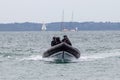 British police patrolling in a rigid inflatable boat on the sea