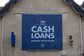 08/09/2020 Portsmouth, Hampshire, UK A cash loans available sign on the side of a pawnbrokers shop Royalty Free Stock Photo