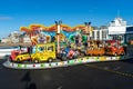 A fairground ride at an amusement park with cars to ride Royalty Free Stock Photo