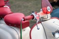 A close up of the throttle or handle bars on a lambretta scooter or moped