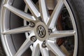 A closeup of the spokes of an allow wheel on Volkswagen or VW racing car