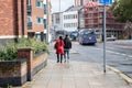 08/12/2019 Portsmouth, Hampshire, UK a couple walking together under an umbrella sheltering from the rain