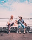 06/04/2020 Portsmouth, hampshire, UK An elderly couple relaxing on a bench at the seaside