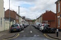 04/30/2020 Portsmouth, Hampshire, UK An empty english street with cars parked and no traffic on the road