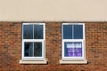 02-28-2021 Portsmouth, Hampshire, UK An estate agent sold sign in the window of new apartments or flats Royalty Free Stock Photo