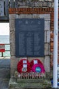 The falkands war memorial st sally port, Old portsmouth, UK with poppy wreaths in front of it