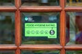 08/09/2020 Portsmouth, Hampshire, UK a food hygiene rating sicker with a rating of 5 in the window of a restaurant or takeaway