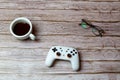 02-04-2021 Portsmouth, Hampshire, UK A google Stadia games contoller laid on a desk or table next to a coffee and glasses Royalty Free Stock Photo