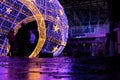 12/15/2019 Portsmouth, Hampshire, UK a group of teenagers standing under a lit christmas decoration in a city centre