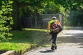 10/04/2020 Portsmouth, Hampshire, UK A landscape gardener using a leaf blower to blow away freshly cut grass