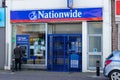 04/01/2020 Portsmouth, Hampshire, UK A man using a cashpoint or ATM outside a closed Nationwide Building society branch