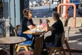 09/14/2019 Portsmouth, Hampshire, UK a middle aged woman and her elderly mother talking whilst having a coffee in a coffee shop