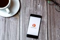 02/10/2021 Portsmouth, Hampshire, UK A mobile phone or cell phone laid on a wooden table with the DuckDuckGo app open on screen