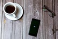 02/10/2021 Portsmouth, Hampshire, UK A mobile phone or cell phone laid on a wooden table with the wimbledon tennis app open on