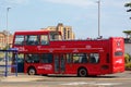 08-04-2021 Portsmouth, Hampshire, UK An open top tour bus at a bus stop at southsea Seafront in Portsmouth in summer