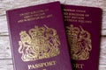 02-08-2021 Portsmouth, Hampshire, UK a pair Of British passports laid on a wooden table Royalty Free Stock Photo