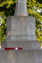 08/09/2020 Portsmouth, Hampshire, UK A red Poppy wreath lain on a war memorial that reads their name 1914-1918 a great war