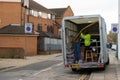 11/05/2019 Portsmouth, Hampshire, UK a removal man in a removal van moving furniture