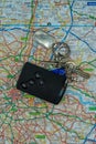 03/14/2020 Portsmouth, Hampshire, UK A set of keys and a car key laid on top of a road map of London Royalty Free Stock Photo