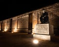 A statue of a world war two soldier lit up at night Royalty Free Stock Photo