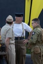 Three men dressed in authentic world war two military dress