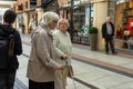 Two elderly ladies in a shopping mall or shopping centre