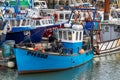 10/20/2020 Portsmouth, Hampshire, UK Two fishermen talking on a fishing trawler that is docked on a quayside