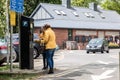 Two women using a pay and display parking machine or meter in a car park Royalty Free Stock Photo