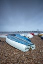 Upturned wooded fishing boats on a pebble beach