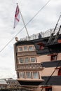 The white ensign flying above the stern of HMS Victory, Lord Nelsons Flagship From the battle Royalty Free Stock Photo