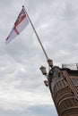 The white ensign flying above the stern of HMS Victory, Lord Nelsons Flagship From the battle Royalty Free Stock Photo