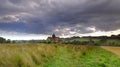 Summer stormy sunset over St Hubert`s Church at Idsworth, near Finchdean in the South Downs National Park, Hampshire, UK