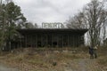 Portuary coffe building with autum forest and tourist at chernobyl radioactive disaster exclusion zone Royalty Free Stock Photo