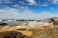 Portugal. Algarve. A tourist photographs the beautiful seascape of Castelejo beach