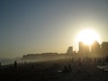 Portugal, Algarve, Portimao, Praia da Rocha. Beach with people and town in sunset time, horizontal view. Royalty Free Stock Photo