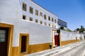 Portugal, Evora street with houses and hotel , with yellow painted facades