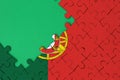 Portugal flag is depicted on a completed jigsaw puzzle with free green copy space on the left side