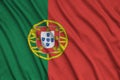 Portugal flag is depicted on a sports cloth fabric with many folds. Sport team banner Royalty Free Stock Photo