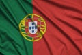 Portugal flag is depicted on a sports cloth fabric with many folds. Sport team banner Royalty Free Stock Photo